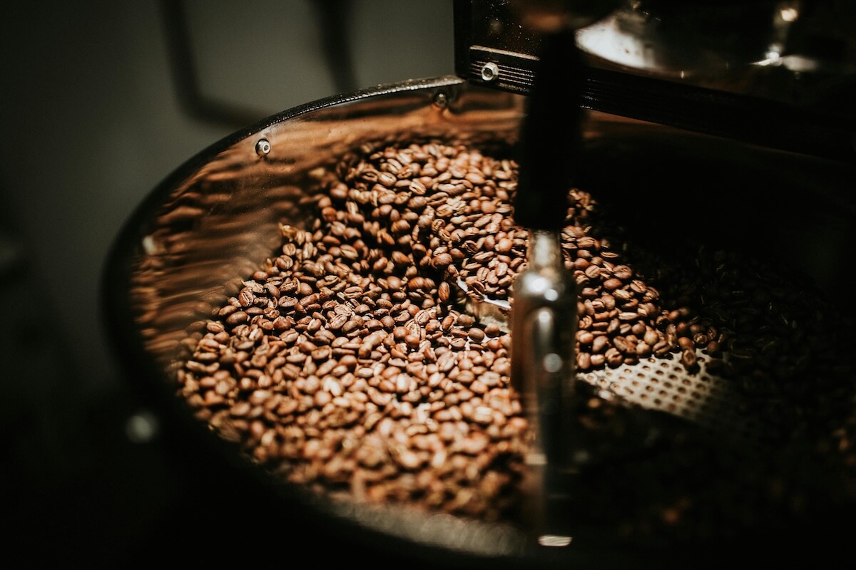 Close-up of dark roasted coffee beans, the ingredient at the center of Ethiopia's most enduring social tradition