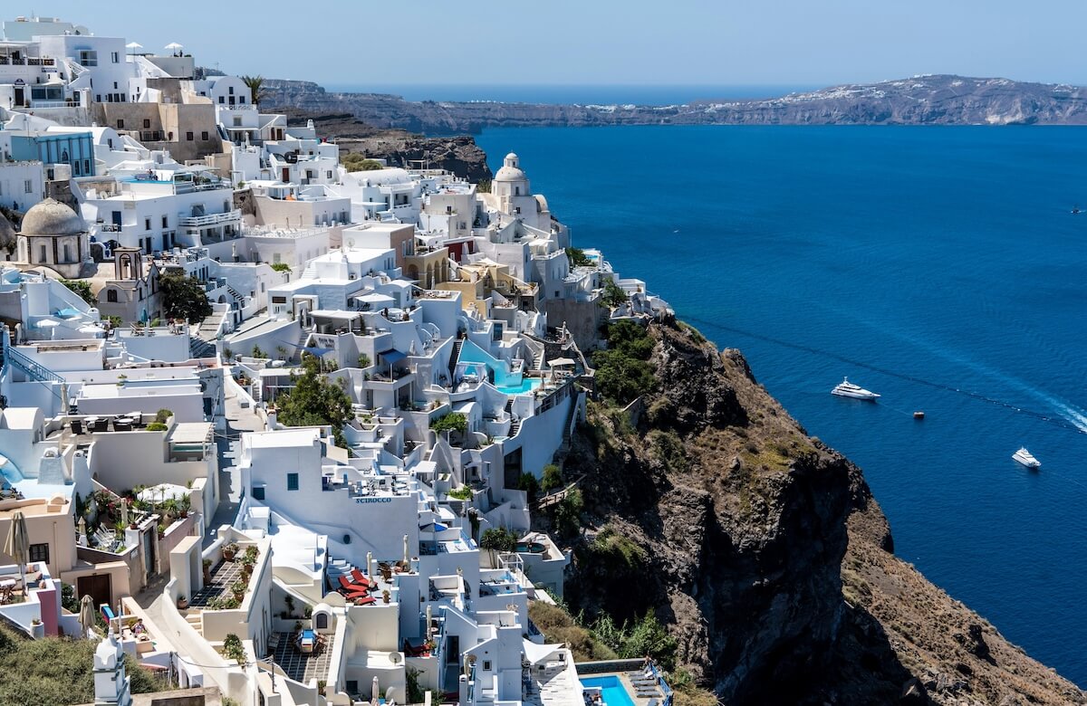 Santorini Greece white buildings overlooking Aegean Sea