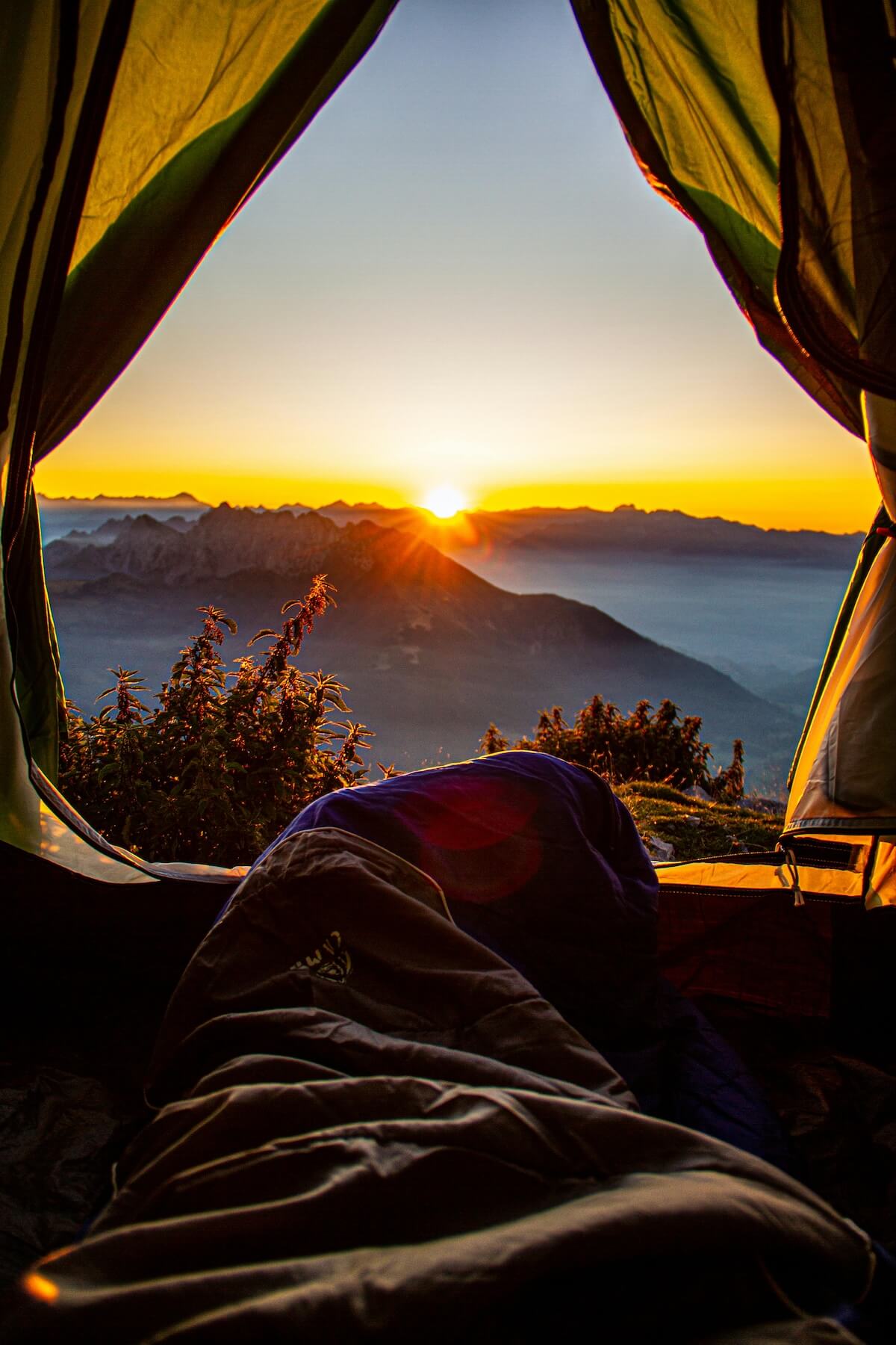 Watching sunrise from mountain tent