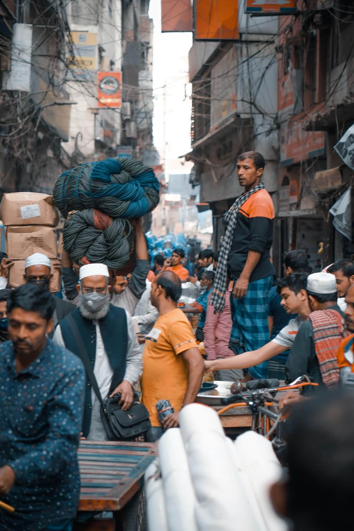 Crowded urban street market with diverse people