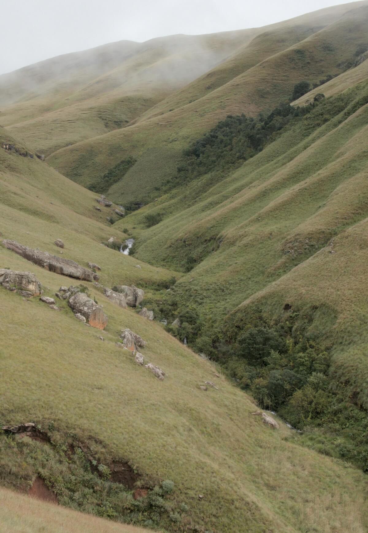 Lush green rolling hills representing Rwanda's thousand hills landscape