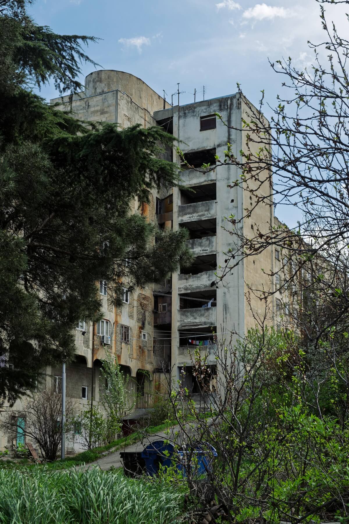 Soviet-era apartment buildings with trees in Tbilisi Georgia showing brutalist architecture