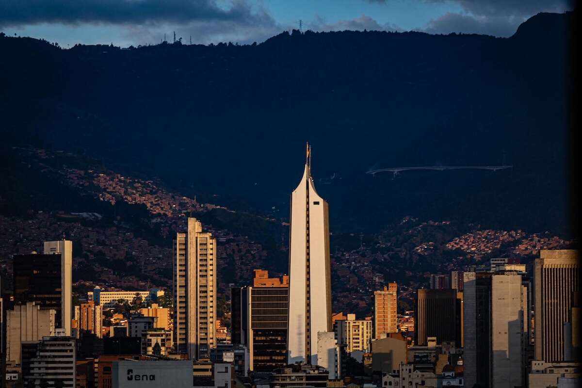 Skyline of Medellín Colombia with Coltejer building and mountains