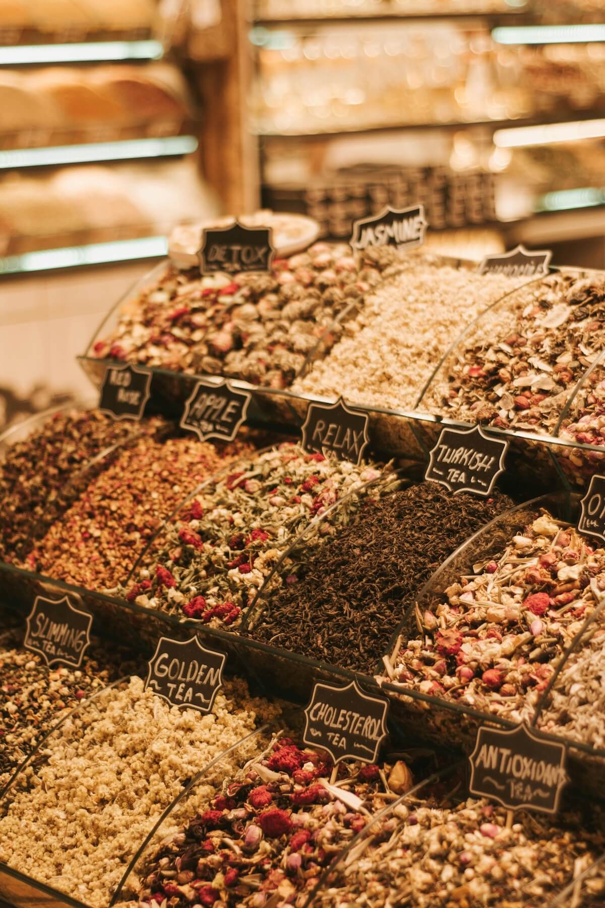 Colorful display of loose tea varieties at a Turkish bazaar stall