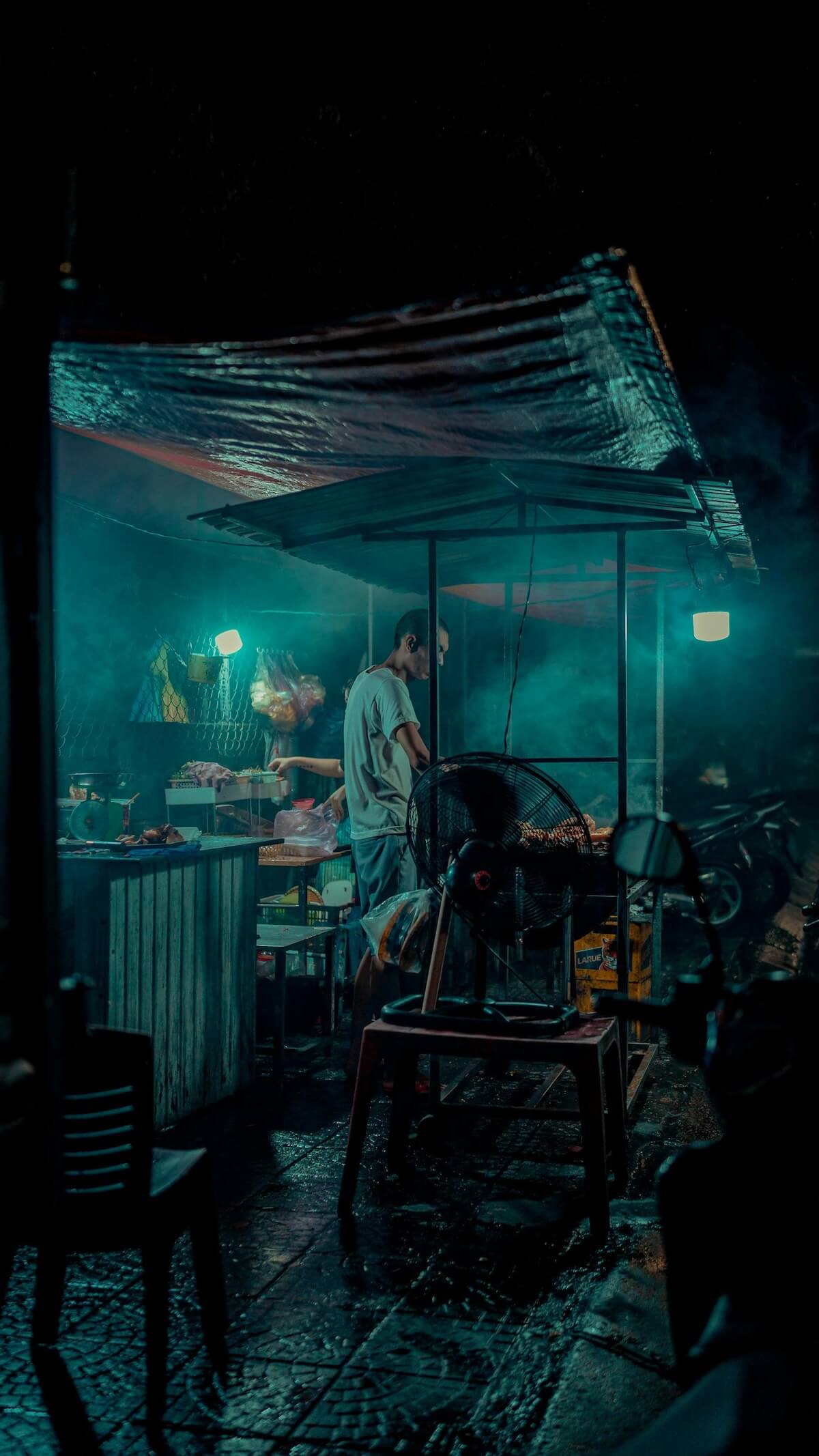 Bustling night street food stall in Hanoi, Vietnam
