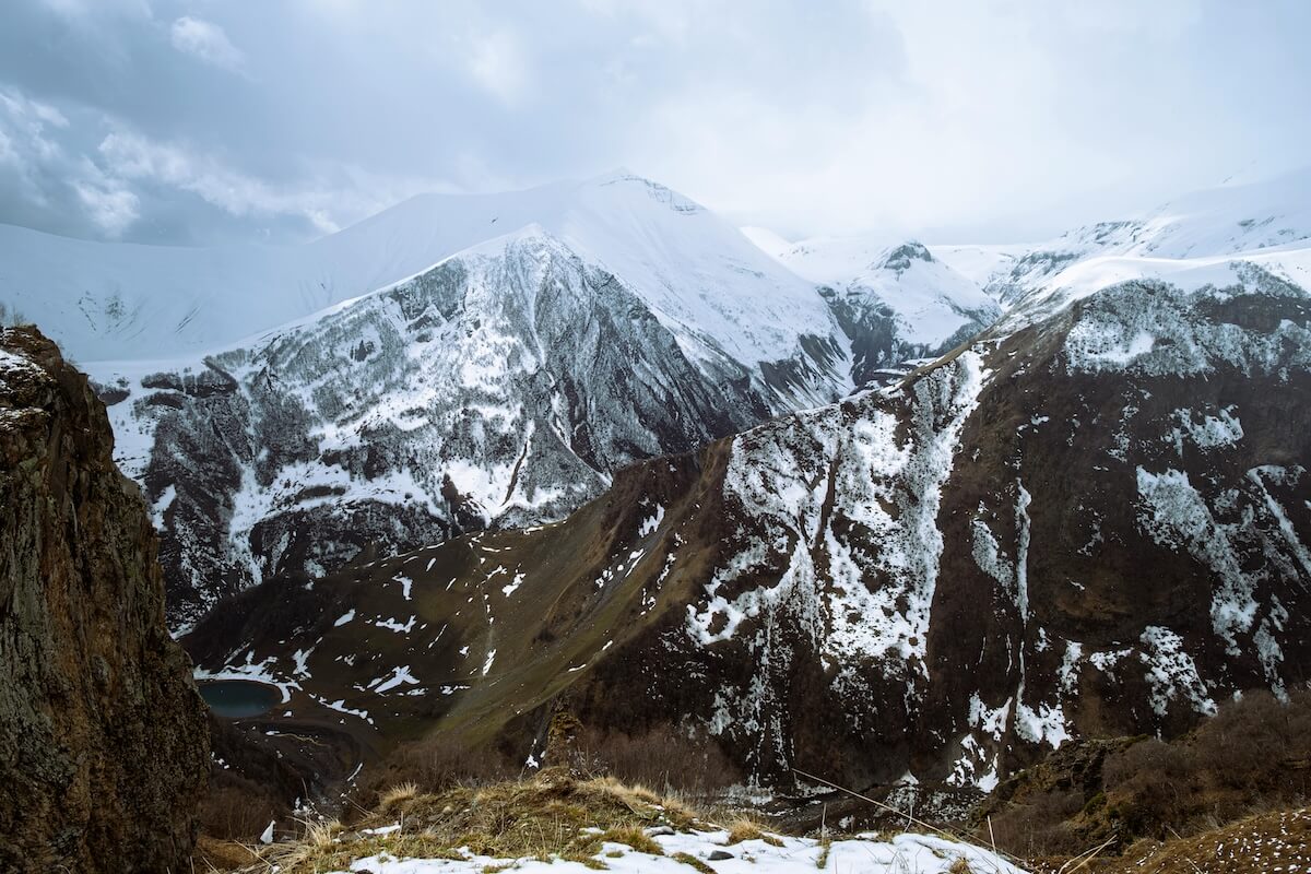 Snow-covered mountain peaks in dramatic Caucasus landscape in Georgia