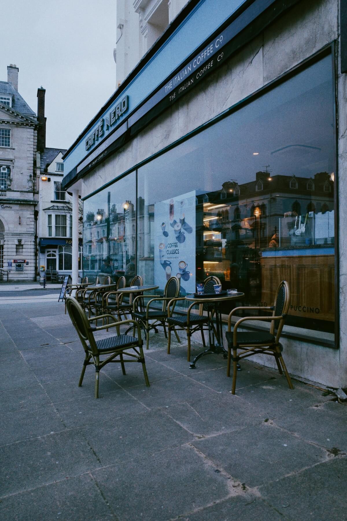 Charming European street cafe with outdoor seating and elegant architecture