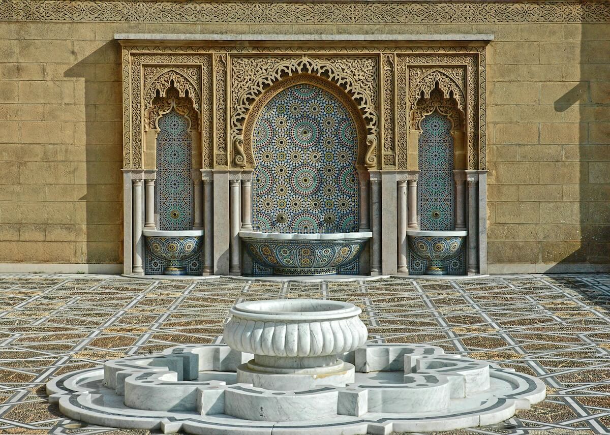 Intricate Moroccan fountain with zellige tilework and carved details