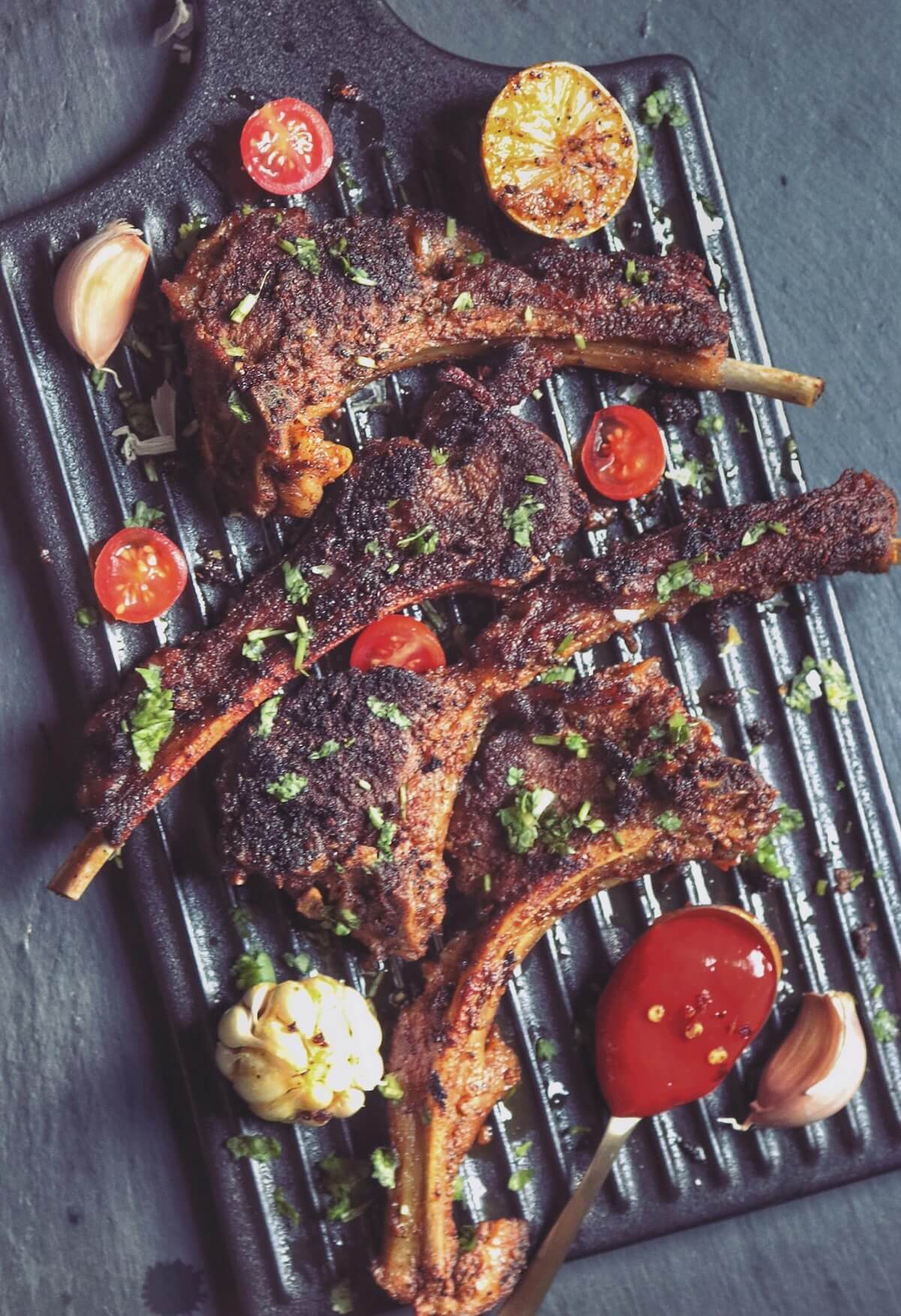 Grilled lamb chops with herbs and vegetables, traditional Albanian style