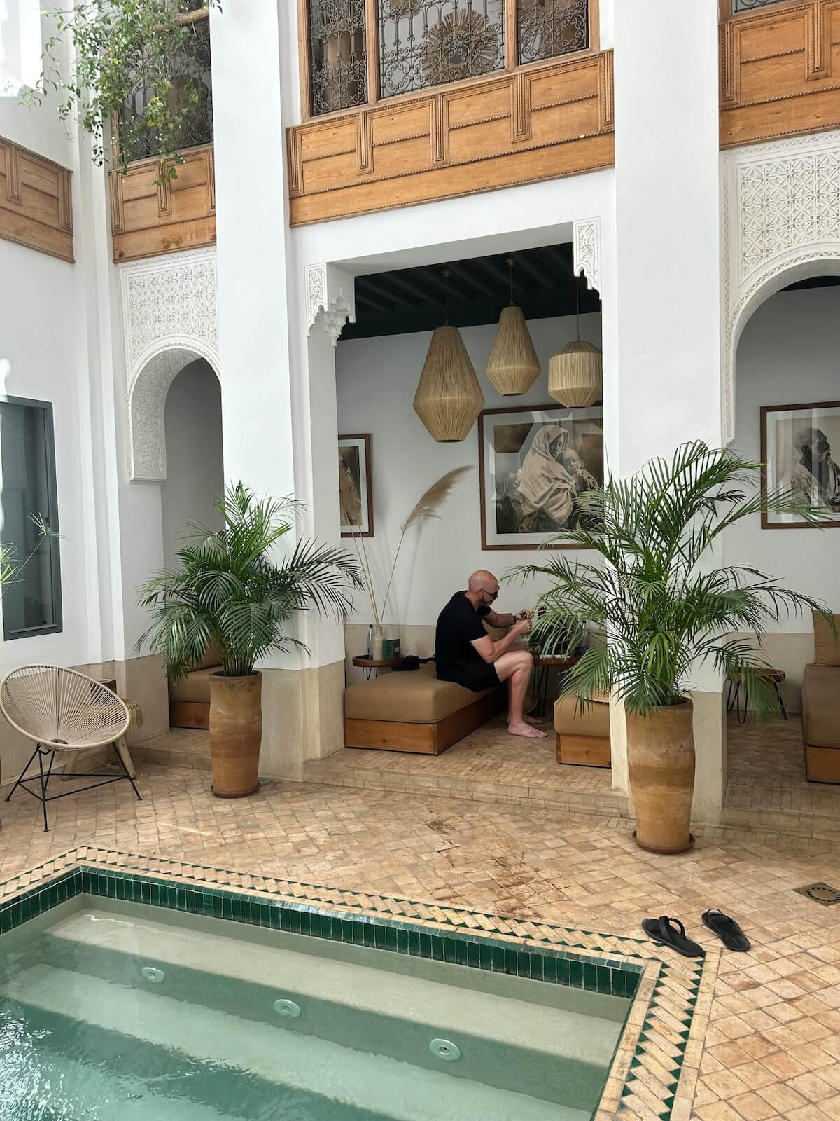 Traditional Moroccan riad courtyard with pool and tiled interior