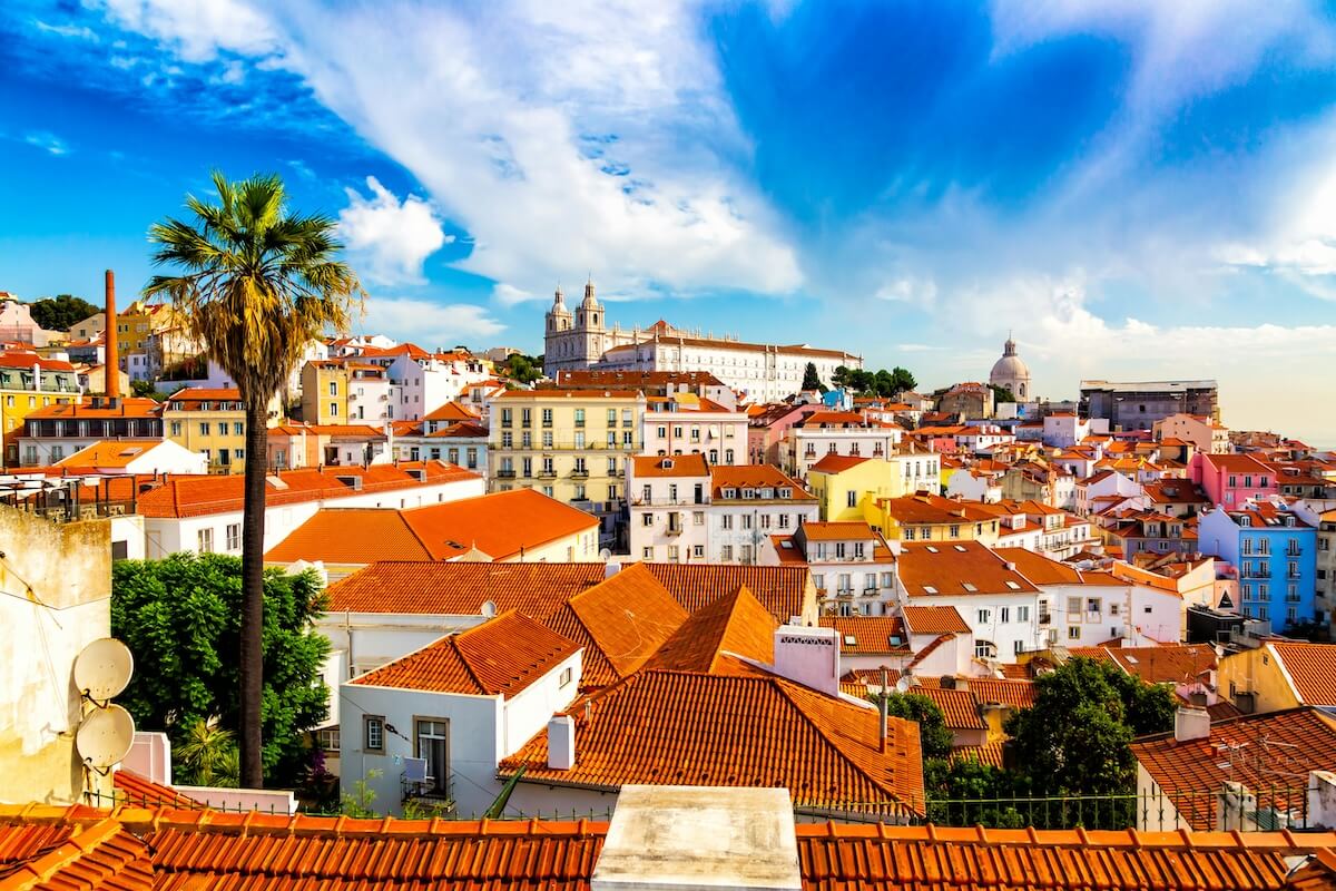 Colorful rooftops of Lisbon's Alfama district with historic architecture and panoramic views