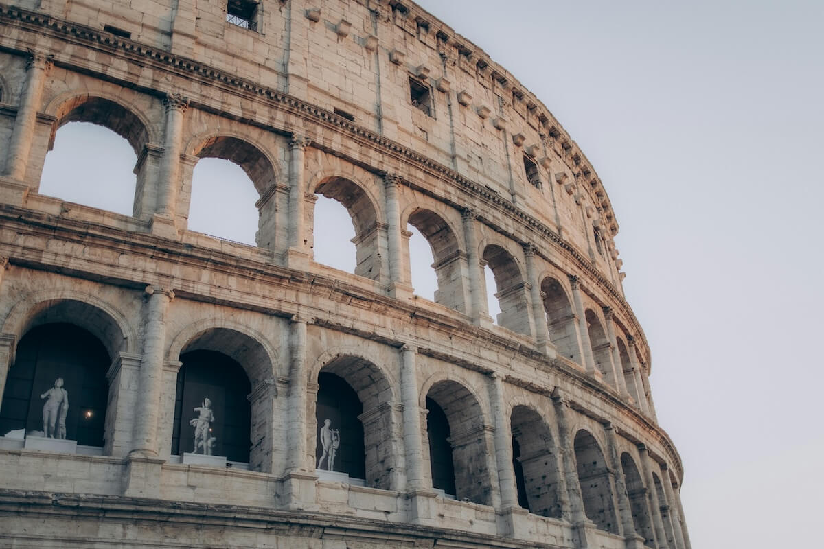 Colosseum at sunset in Rome Italy golden hour lighting